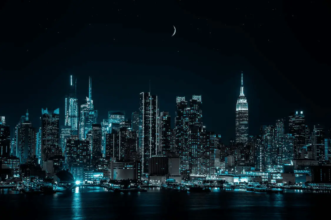 New York City skyline at night, one of the safest cities in America.