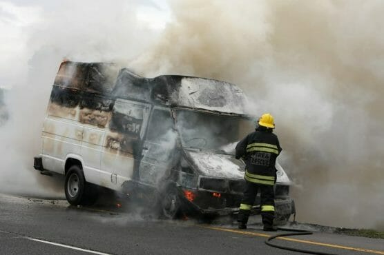 Fireman And Burning Vehicle