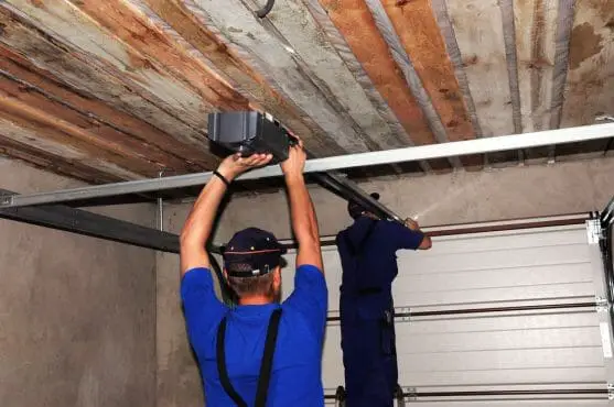 Contractors Installing Garage Door Opener. Repair Garage Door Opener