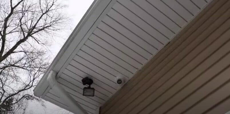 mount the security camera on the sofit