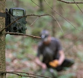 trail camera and a man