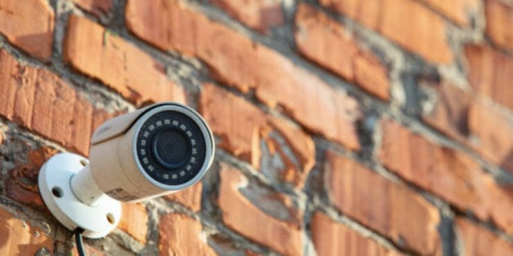 security camera on brick wall