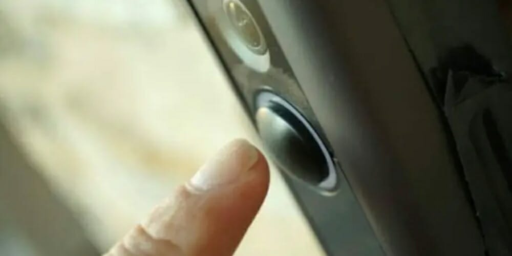 pointer finger pressing the Ring doorbell