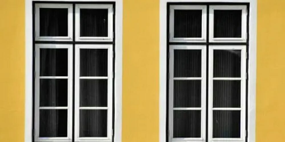 windows in a yellow wall