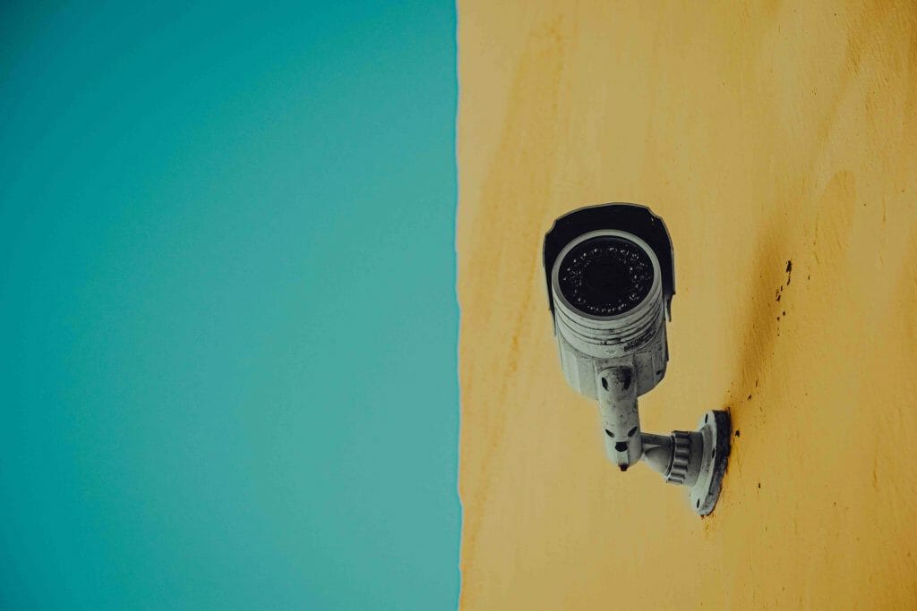 security cam on a cyan and yellow wall