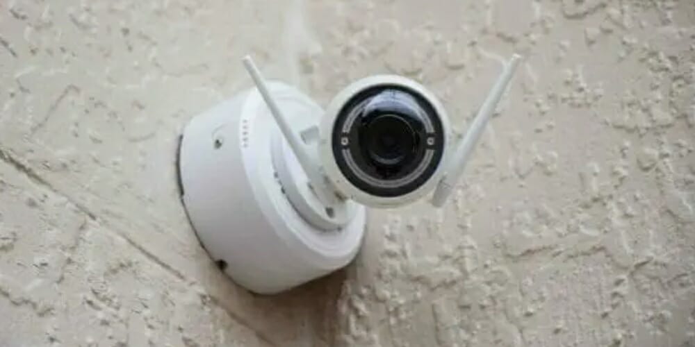 security camera mounted on the outside rough wall