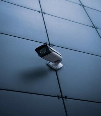 security camera on tiled wall