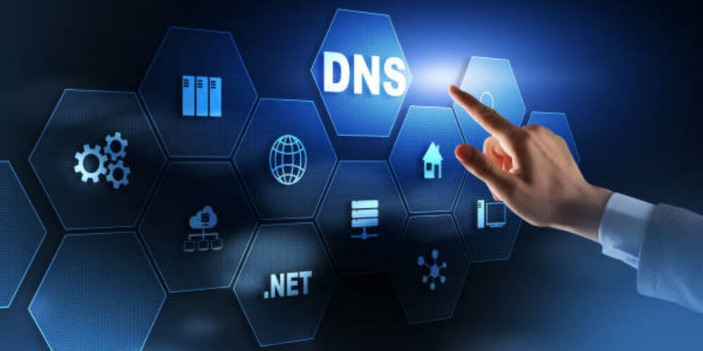 a man pointing to a digital board with the word DNS
