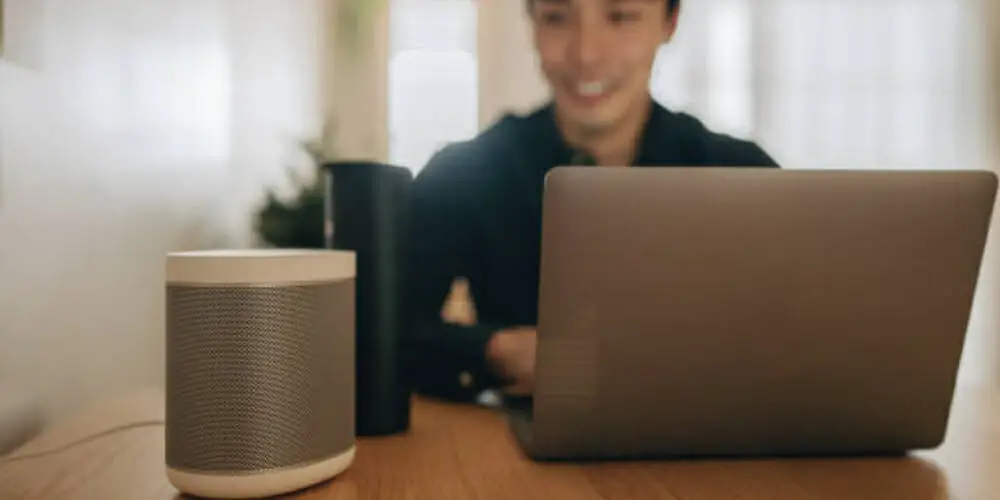 man with laptop and alexa