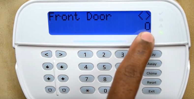 man setting up the front door to be bypassed on ADT device