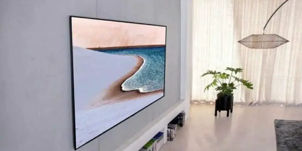 slim flat screen tv mounted on the wall