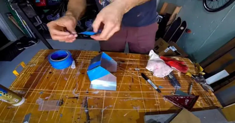 using tape to cover the metal sheet