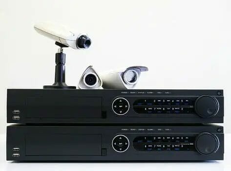 two NVR and security cameras on top