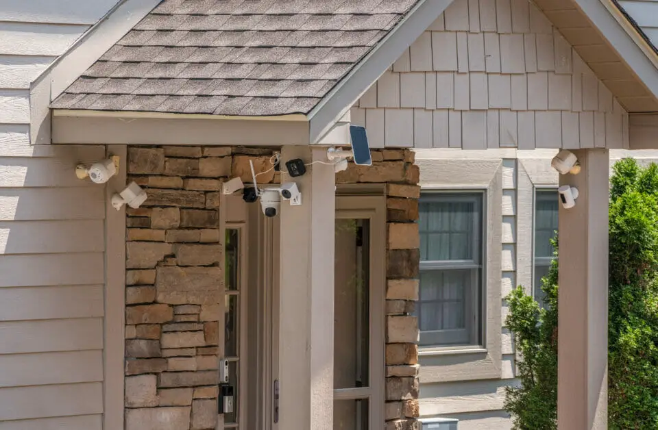 a bunch of security cameras installed outside a home's entrance area