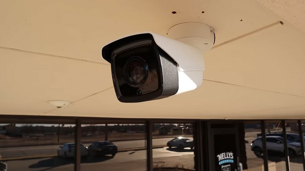a cctv camera installed at the indoor ceiling