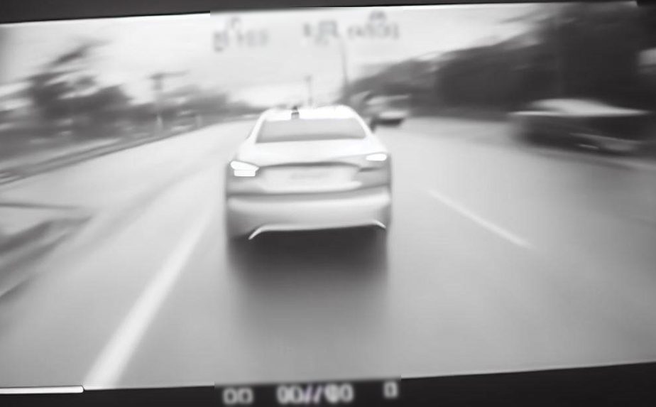 a video image of a car ahead on the street