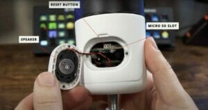 an open cctv camera showing the speaker, reset button and a micro sd slot