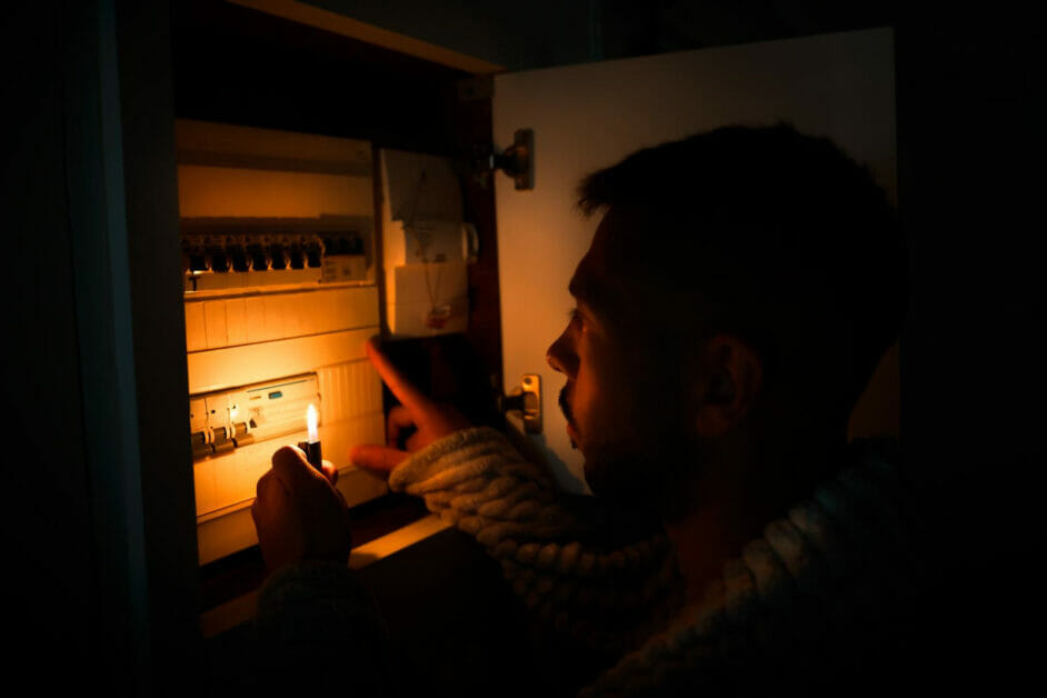 man checking the main power due to power outage