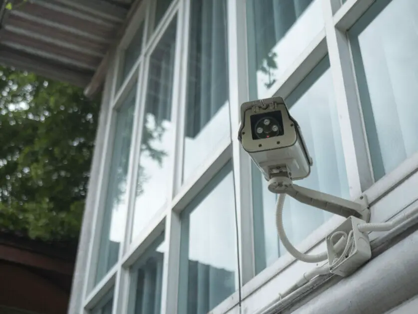 security camera installed outside of a building wall