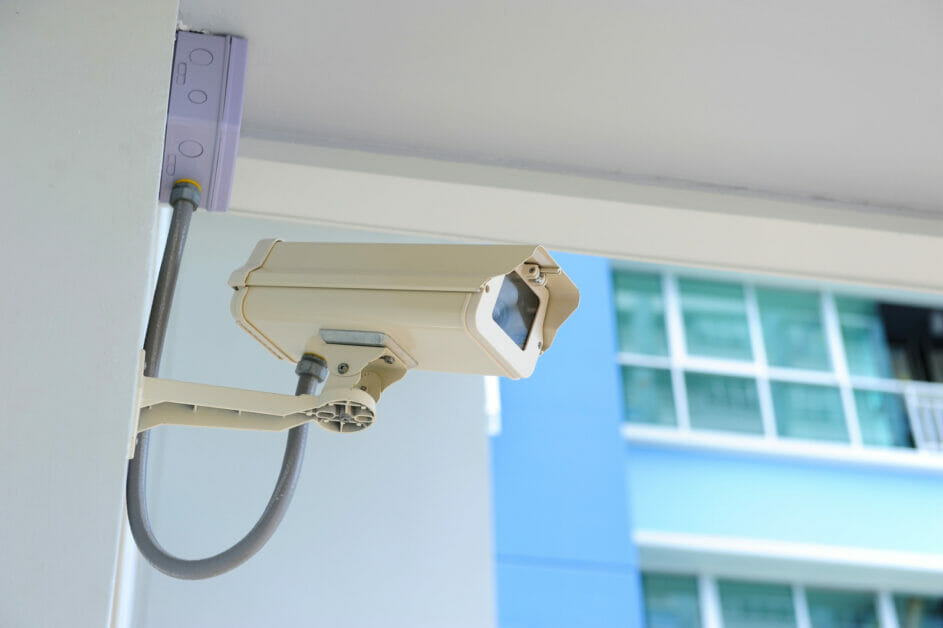 wired cctv camera installed at the outdoor corner of the house wall